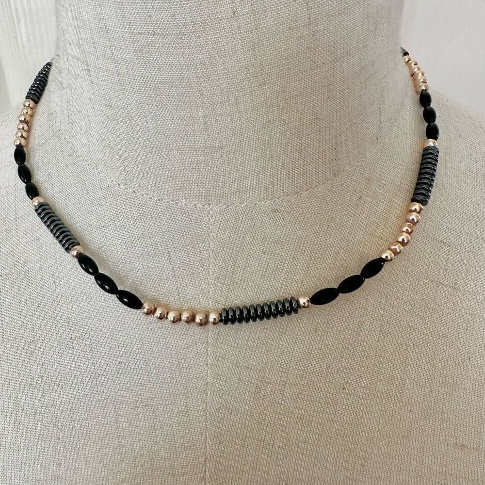 Blackโand gold tone beadedโnecklace